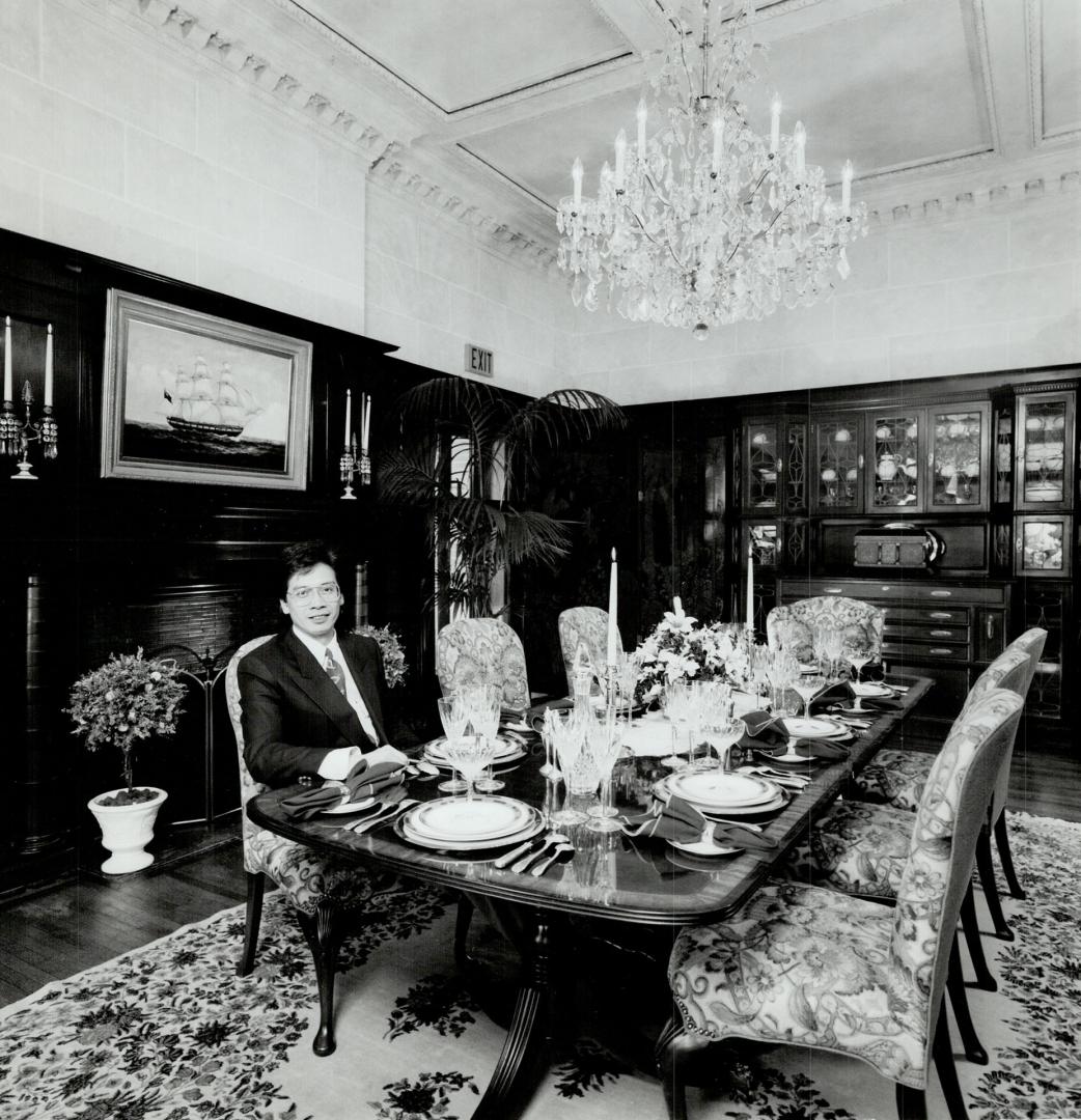 Interior designer Joseph Cheng outfitted the elegant dining room with fine antique furnishings.