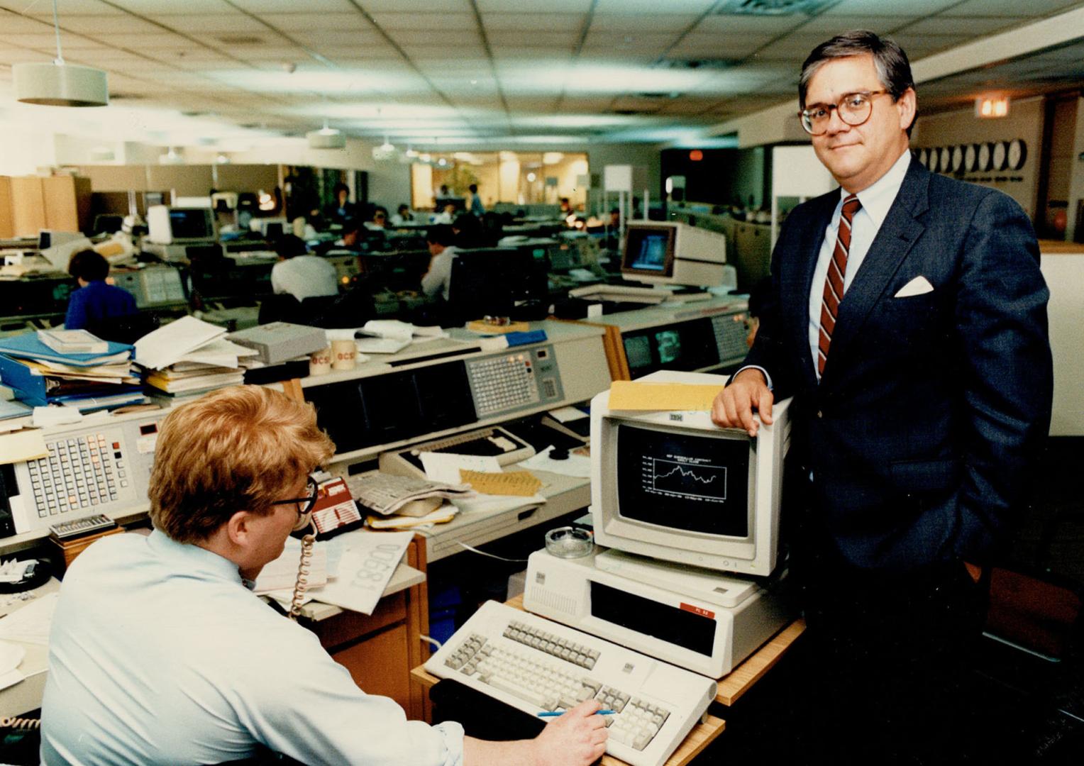 Profiting from patience: Jeffrey Chisholm, right, executive vice-president and treasurer for the Bank of Montreal, took over the bank's treasury operations in April. Trader Alex Jurshevski, left, has information at his fingertips. Chisholm says the bank's traders are skilled at figuring out what's important.