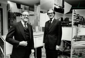 Sunny smiles: Sun Life of Canada president George Clarke (left) and chairman Thomas Galt stand before model of new headquarters at annual meeting yesterday. Meeting heard of big growth in assets.