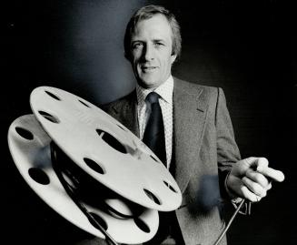 Marshall Crossley holds his firm's plastic spool