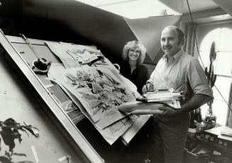 Attic studio: Ken Dallison and his wife, Gwen, with model of space shuttle in their farmhouse.