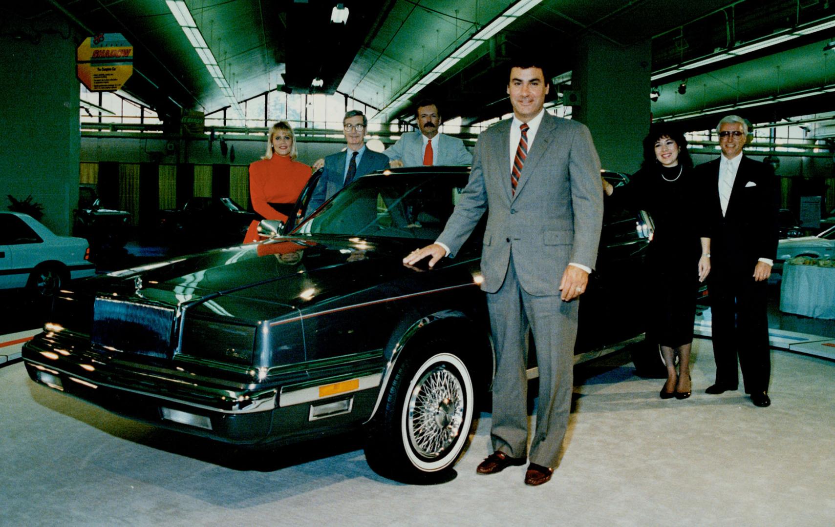 Roomiest Chrysler: John Damoose, Vice-president of sales for Chrysler Canada, can take five friends along in the new six-cylinder Chrysler New Yorker Landau.