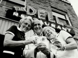 Farewell to The Dell: Owner Bill De Laurentis and waitresses Jean Ramsdell, left, and Christal Shambrook, raise a final toast to The Dell Restaurant and Tavern at Simcoe and Elm streets, which has been open since 1948. The official closing date is July 15.