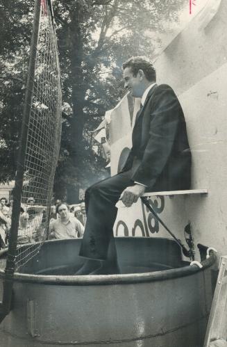 Hit the mark -- and dunk a veep. Gordon Fleming, financial vice president of Canada Life Assurance, was the victim when this executive dunk went into the action at the company's three-day celebration of its 125th anniversary, on the north lawn of the head