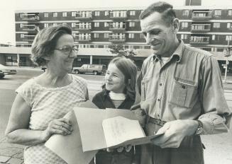 We're all owners here, says Ronald Field, here outside the family's co-operative apartment building on Main St. with his wife Mary and daughter, Florence. When superintendent stopped cleaning, the Fields did it.