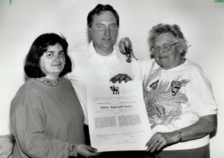 Four years later: Brampton's Robert Fraser, flanked by wife Tina and mother Margaret, with his governor-general's medal for bravery and his official citation for having saved a 10-year-old boy in Lake Erie