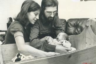 Baby Mandy Ann is admired by her parents, Clay and Josie Hatfield, in their Kipling Ave. home where Mandy Ann was born