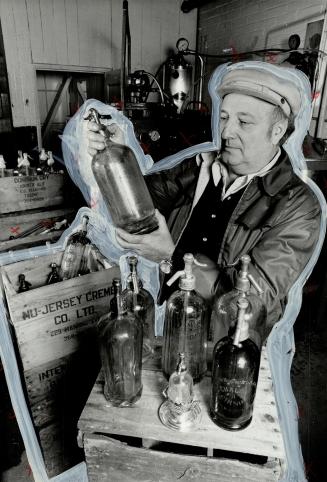 Soda Syphons: Owner Sammy Goldhar of Toronto's Nu-Jersey Creme shows off old glass bottles.
