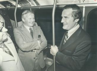 Strap-hanging VIPs: William Davis escorted Massachusetts Governor Edward King on a tour of Toronto's subway system yesterday