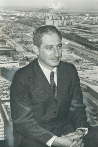 Walter Kissinger, brother of President Nixon's top foreign policy adviser, takes a magic-carpet perch above downtown Toronto from the 38th floor of the Toronto Dominion Tower