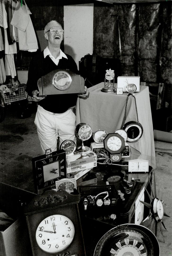 Bill Holman with clock collection