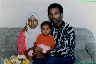 Wait ends: Osman Isse and family, including son Abdulaziz, were let into Canada.
