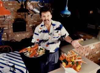 Cashing in: Ken kadanoff, a seafood-loving lawyer, displays some of the choices available at the Dockside Sea market restaurants he co - founded