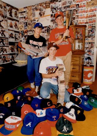 Way to play ball! The Kaplan brothers, Darryl, 13, Randy, 15, and Cary, 18, deserve their own Sports Hall of Fame - just to house the thousands of baseball cards and other memorabilia the North York trio have collected since they were in diapers