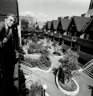 Elegant courtyard: Architect Aaorn Landau, above, shows off award-winning landscaped courtyard, part of a major renovation in Cabbagetown.