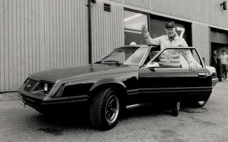 John Leppiko, 77, waves happily beside his totally restored 1984 Mustang