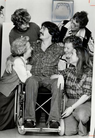 Self-sufficient: Dennis Mackie demonstrates his new electric wheelchair for members of the Scarborough Glen Stewart IODE, who presented it: From left, Sue Harrison, Anne Lewis, Fran Robinson and Edna Jennison, with his fiancee, Lee Cunningham, Looking on