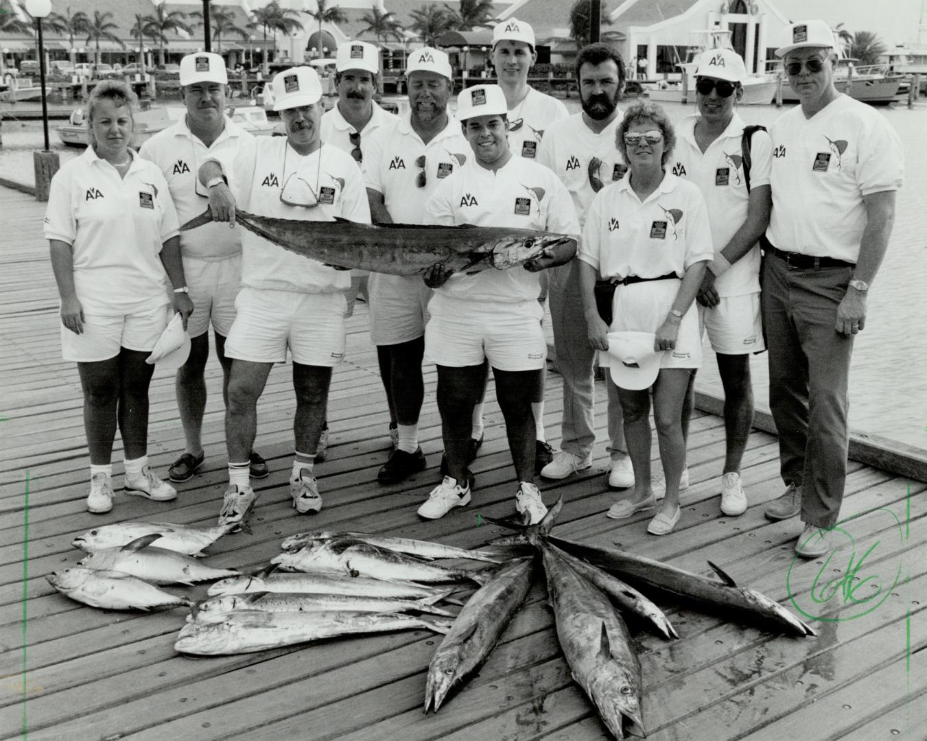 Pick of the Bunch: Don IMcRae, surrounded by fellow Tournament of Champions anglers, holds the tail of his winning catch-of-the-day in Aruba.