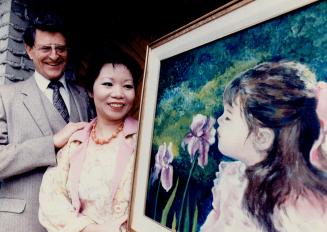 Historical mansion: Elaine and Dennis Mascall look at a picture Elaine painted of their daughter, Danielle