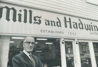 Still at it after nearly half a century, car dealer Guy Mills continues to put in a full day at the office