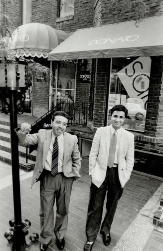 Fashionable brothers: Donato, left, and Tony Policelli wear some of the Basile linens for summer outside their Yorkville Ave. menswear store, Donato.