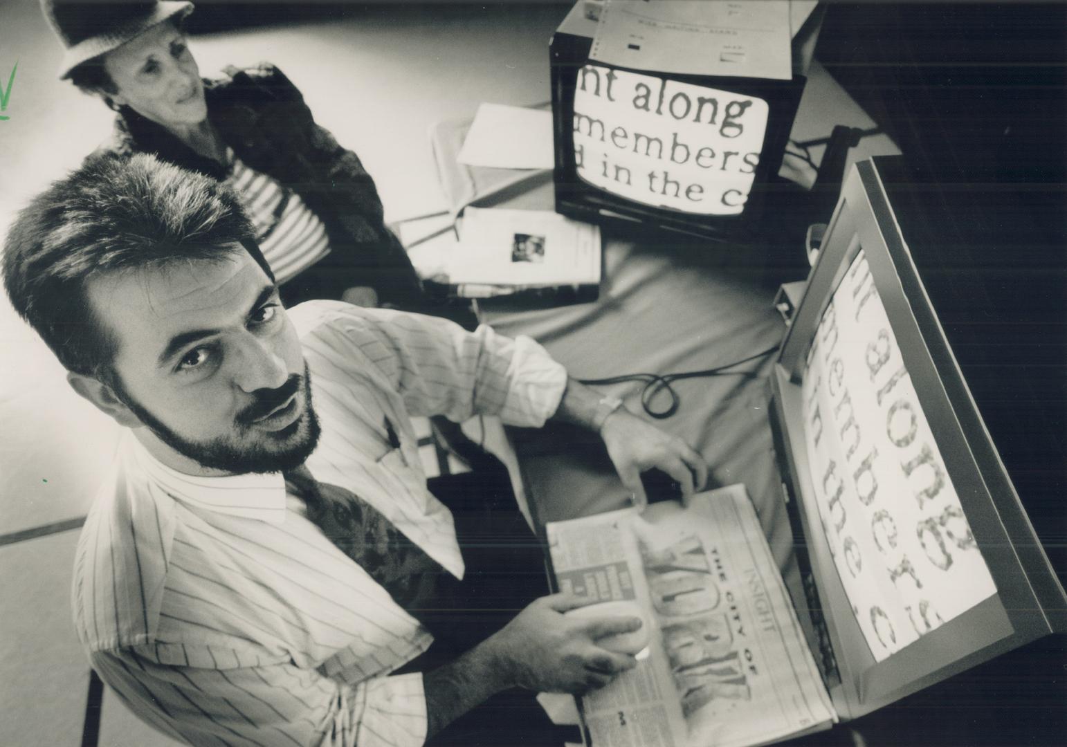 George Priftis Distributes a hand-held magnifying device that allows partially sighted people to read and write.