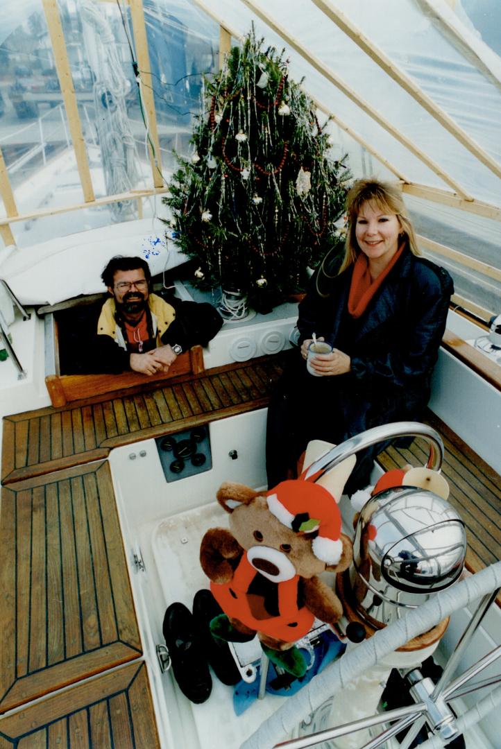 Deck the deck with Christman trimmings, advise Rusty Rafuse and Lisa Cooper, enjoying theirs.