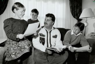 Basic Training: Tony Rosa, founder of Brampton's Theatre Showcase for children 7 to 15, goes over scripts with students, from the left, Lindsay Coleman, Kristopher Giles, and Eric Giles in his living room