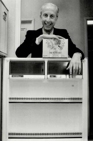 Empty fridge: Colin Rose, originator of the Micro diet, holds a box of the low-calorie dried food that's taking Britain by storm.