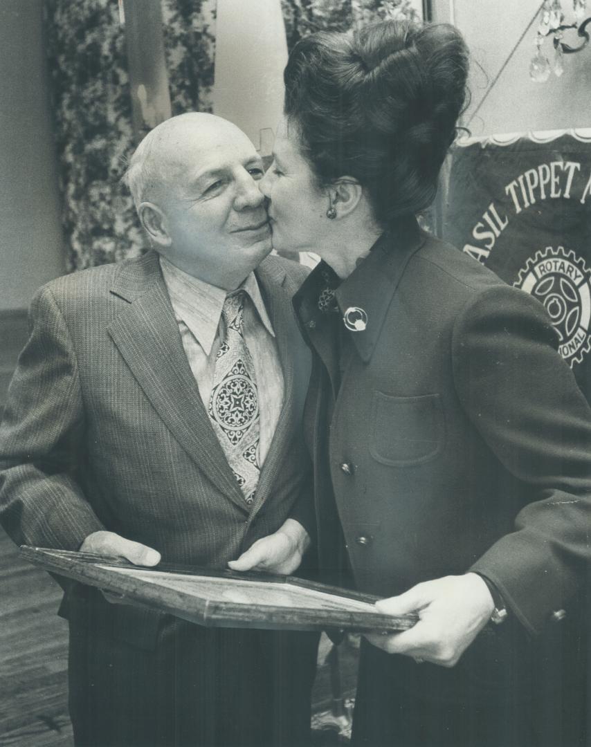 Scarborough Citizen of the Year Thomas Joseph Shoniker gets a kiss from Margart Birch, who won the same award in 1970