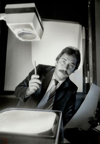 Looking for help: Jim Slaven, general manager of Toronto Executive Consultants, seen here with overhead projector, was one of the organizers of Job Fir, a new method to attact skilled personnel to the labor-short computer industry