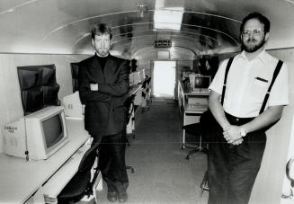 Teachers Mike Sloan, right, and John Grant take a classroom on the road.