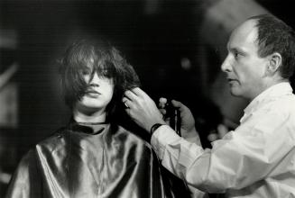 Cutting up: Internationally famous hairdresser, creator of 'the wedge' and 'scrunch drying,' Trevor Sorbie works on a model at Massey Hall show.