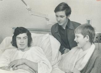 Peter Steiner, the 14-year-old boy injured on a crosswalk by a car that killed the crossing guard, has visitors in his room East General Hospitals: John Thauberger, 14, a fellow pupil at St