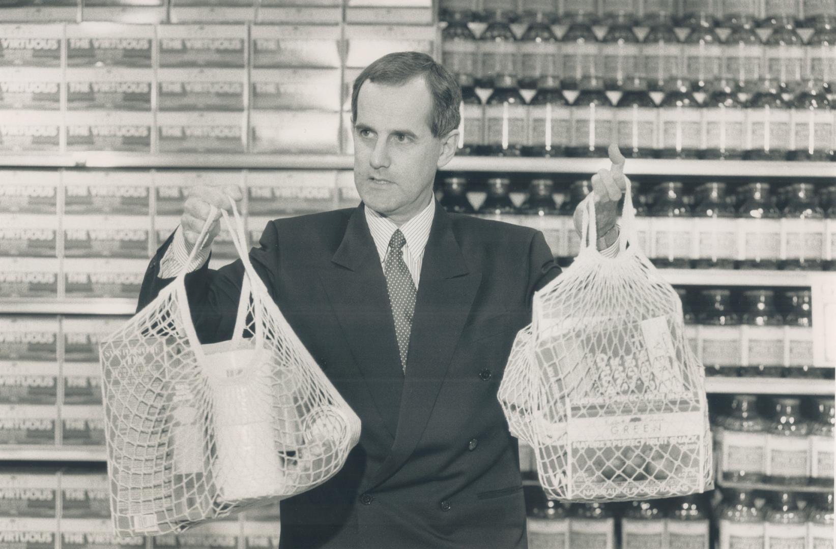 Making a difference: Loblaws president David Stewart holds up new string shopping bags the firm will sell