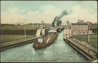 Two steamers leaving the locks. The first a whaleback, a cargo steamship with a hull that conti ...