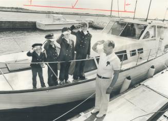Four grandsons, decked out in sailors' uniforms, salute Bill Turner of Etobicoke as he prepares to launch the 36-foot cabin cruiser he built over five years