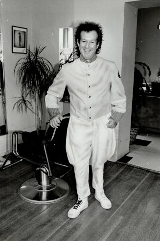 Coiffing everyone from rock stars to pharmacists, John Steinberg, left, owner of The Rainbow Room sports his current pastiche look -- white Chinese jodhpurs circa 1936, a yellow busboy's jacket and sneakers with black and yellow laces