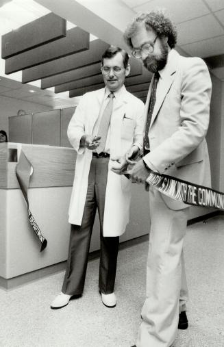 Scalpel, please: The ribbon is cut on the new emergency unit at Scarborough Centenary by Dr. Paul Truscott, acting chief of staff (left), and Dr. Edmund Urovitz, head of the medical staff society.