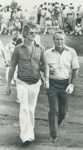 Weary Golfers trudge off course. Arnold Palmer shot 72, George Knudson was 70