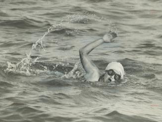 The second teenager to tackle Lake Ontario in 72 hours, 14-year-old Angela Kondrak of the Borough of York is shown at daybreak in her bid to swim to the CNE