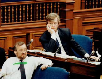Two views: Premier Bob Rae, left, announces vote on Sunday shopping in Legislature yesterday as excabinet minister Peter Kormos reacts glumly.