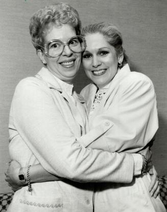 Don't cry for her: Leanna Nicholls, left, of Vancouver, hugs Evita star Florence Lacey backstage at the O'Keefe Centre