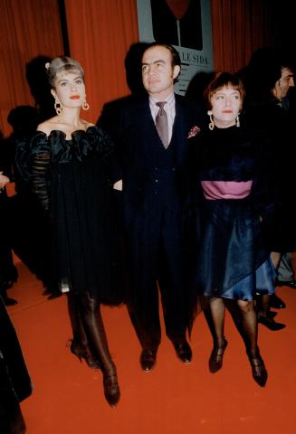 Above, making a serious entrance, Lacroix model Marie Seznec, left, with designer Christian Lacroix and his wife Francoise.