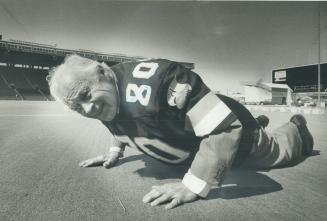 No stopping him: Once briefly an Argonaut, former Toronto mayor Allan Lamport donned the double blue jersey this week to demonstrate that at 80 he's all alive and kicking, and doing his push-ups