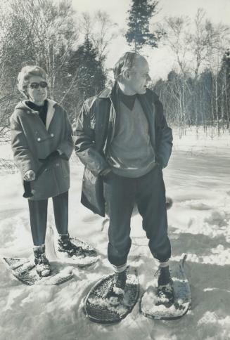 Disappointed but not shattered by his unsuccessful bid for the leadership of the Ontario Conservative party, Mines Minister Allan Lawrence, and his wife, Moira, snowshoe around their winter retreat near Lindsay, Ont