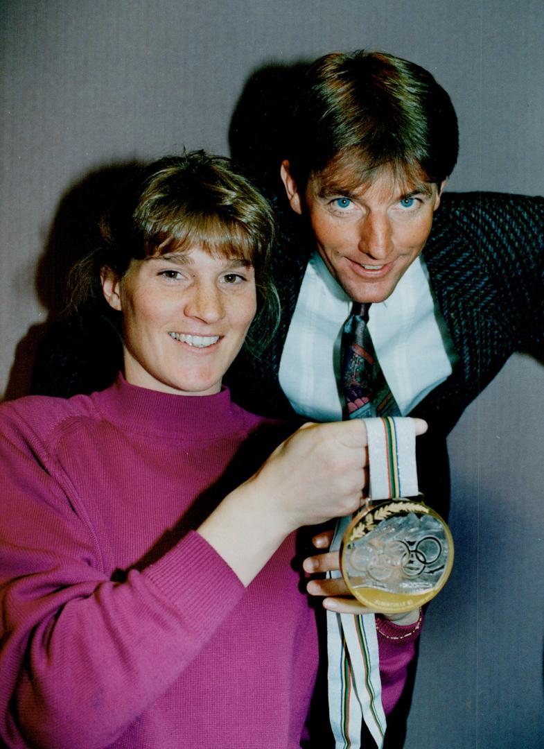 Golden Girl: Olympic downhill champion Kerrin Lee-Gartner and husband Max Gartner display her gold medal yesterday.