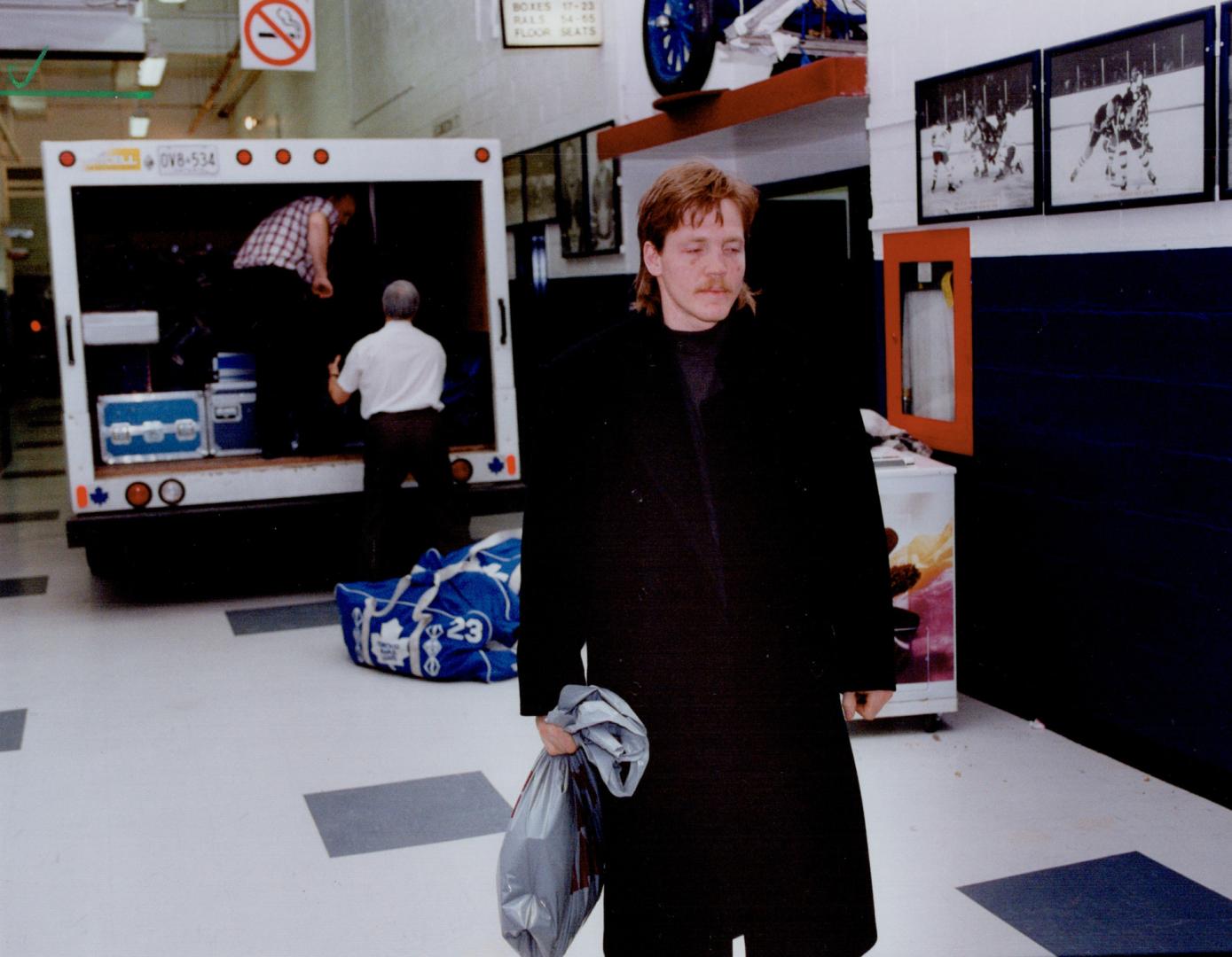 Gary Leeman leaves Toronto Maple Leaf dressing room yesterday for last time after being traded to the Calgary Flames as part of the biggest player swap in NHL history