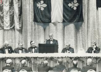 Listening to Quebec Premier Rene Levesque, centre are, from left, Alfred Hayes, chairman, Morgan Stanley International, David Rockefeller, chairman, Chase Manhattan Bank, Hugh Carey, New York governor, James Davant, chairman of the Economic Club and of Paune, Wenner, Jackson and Curtis, and Clifton Garvin Jr