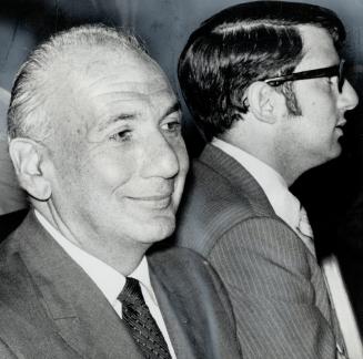 Order of battle: Toronto industrialist Benjamin Levy smiles enigmatically, at left, at the special meeting of shareholders of Seaway Multi-Corp
